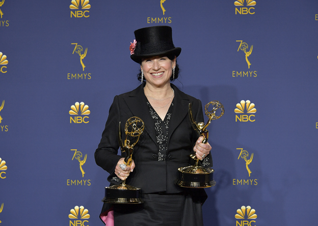 Amy Sherman-Palladino poses with her accolades at the 70th Emmy Awards